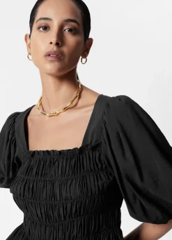 & Other Stories Gesmokte Bluse mit Puffärmeln
